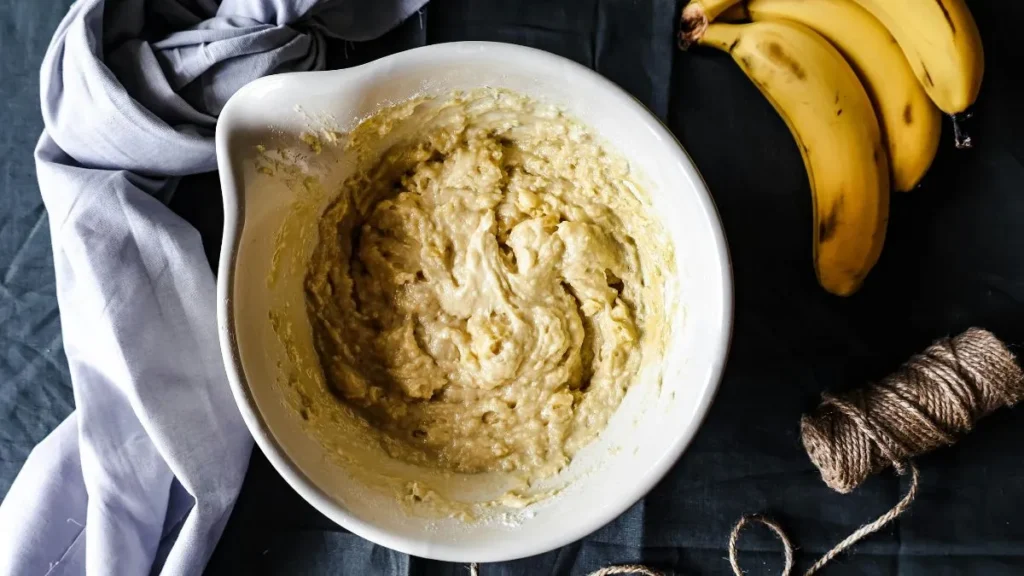 Mixing ingredients for banana bread recipe